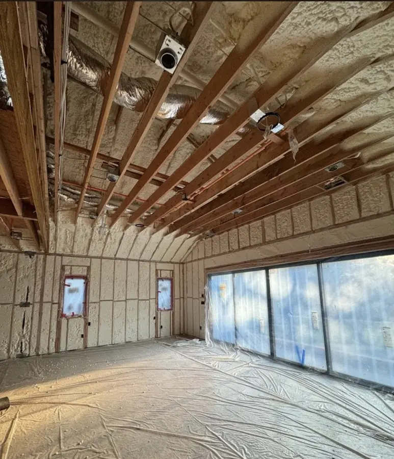 Interior walls and ceiling insulated with spray foam during new construction in Air Force Academy